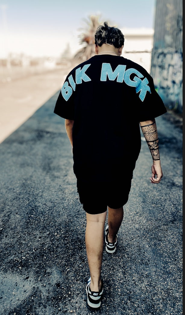 BLK MGK Heavy Tee Blue, back view walking