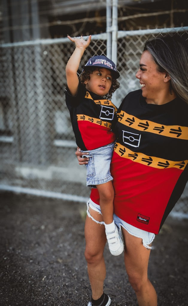Mum and child in matching Ngurrbul Heavy tees