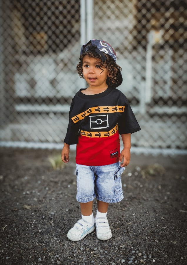 Child wearing the Ngurrbul Heavy tee, front view